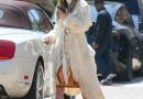 Jennifer Lopez Channeled a ‘70s Movie Star in a Fringe Belted Coat and Tan Skirt